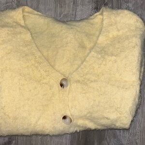 Pale yellow sweater